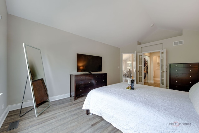 1296 Ashley Ct, Vernon Hills, IL 60061 - bedroom with wood finished floors, lofted ceiling, and french doors