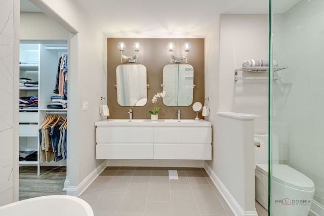 1296 Ashley Ct, Vernon Hills, IL 60061 - bathroom featuring double vanity, tile patterned flooring, a walk in closet, and a shower