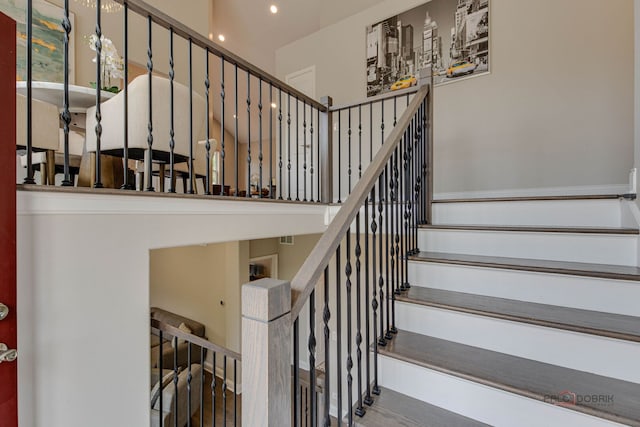 1296 Ashley Ct, Vernon Hills, IL 60061 - stairway featuring a towering ceiling, recessed lighting, and wood finished floors