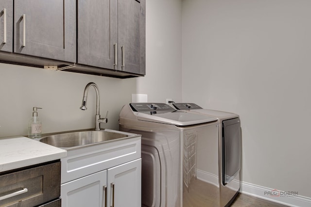 1296 Ashley Ct, Vernon Hills, IL 60061 - laundry room featuring cabinet space, washing machine and clothes dryer, and wood finished floors