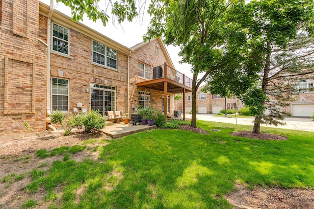1296 Ashley Ct, Vernon Hills, IL 60061 - rear view of house featuring a lawn, a balcony, and brick siding