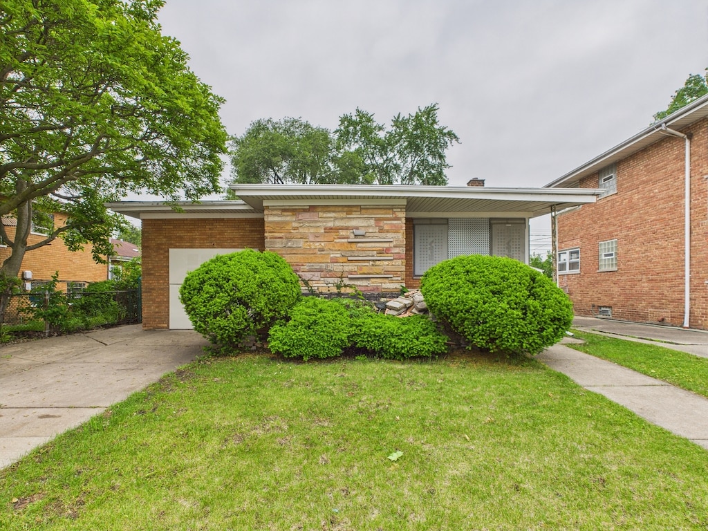 2707 W 84th St, Chicago, IL 60652 - view of front facade with an attached garage, concrete driveway, and brick siding