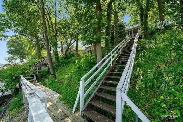 437 Holliday Dr, Lake Holiday, IL 60552 - surrounding community with stairs and a wooden deck