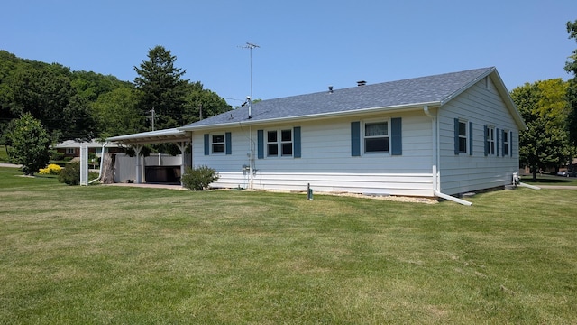 321 Cartwright Ln, Oregon, IL 61061 - back of property with a yard and roof with shingles