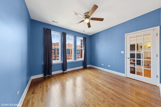 1114 W Pratt Blvd Unit 3S, Chicago, IL 60626 - empty room with a ceiling fan and wood finished floors