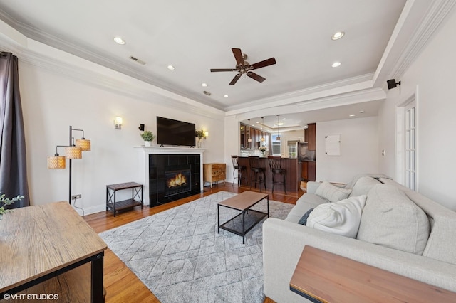1114 W Pratt Blvd Unit 3S, Chicago, IL 60626 - living area with ornamental molding, wood finished floors, ceiling fan, a tile fireplace, and recessed lighting