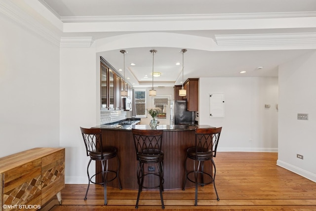 1114 W Pratt Blvd Unit 3S, Chicago, IL 60626 - kitchen with freestanding refrigerator, white microwave, dark countertops, light wood-style flooring, and glass insert cabinets