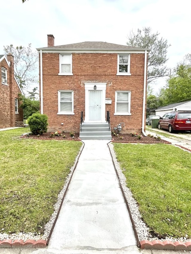 228 E 140th Pl, Dolton, IL 60419 - view of front facade with a chimney, a front lawn, and brick siding