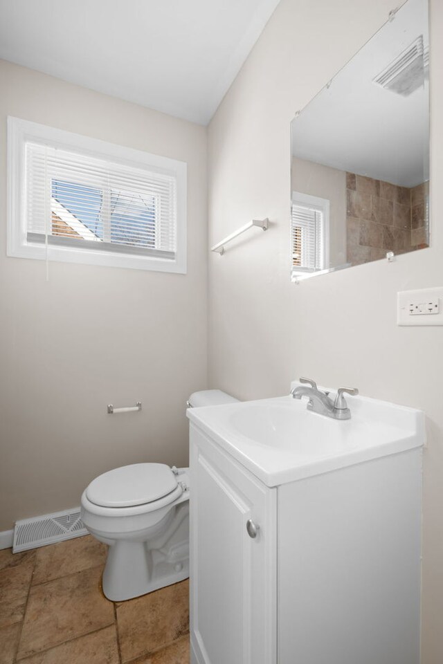228 E 140th Pl, Dolton, IL 60419 - bathroom with vanity, toilet, and baseboards