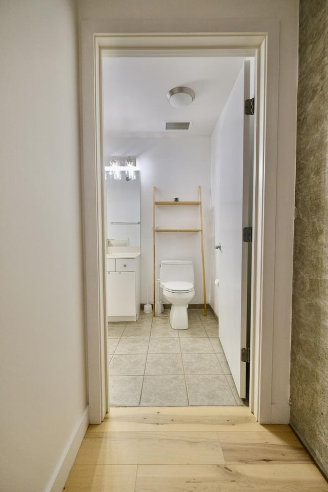 235 W Van Buren St Unit 4206, Chicago, IL 60607 - bathroom featuring toilet, vanity, and tile patterned flooring