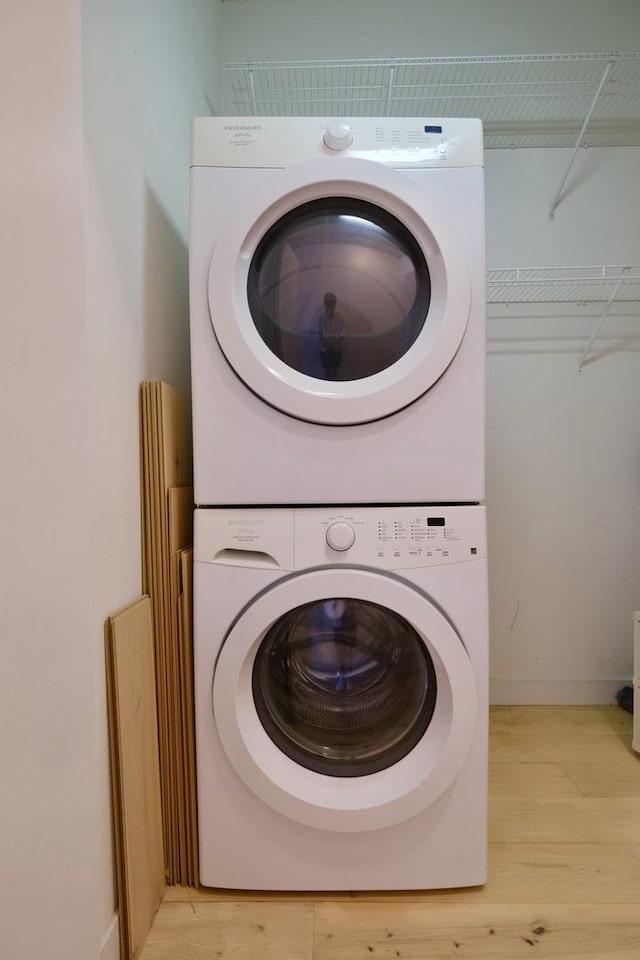 235 W Van Buren St Unit 4206, Chicago, IL 60607 - laundry room with stacked washer / dryer and light wood finished floors