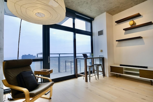 235 W Van Buren St Unit 4206, Chicago, IL 60607 - living area with expansive windows, light wood finished floors, and baseboards