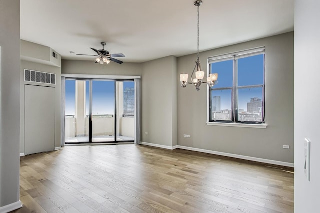 1464 S Michigan Ave Unit 1404, Chicago, IL 60605 - spare room featuring a chandelier, wood-type flooring, and ceiling fan