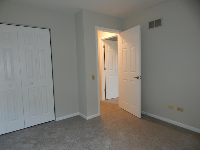 1 N Oltendorf Rd, Streamwood, IL 60107 - unfurnished bedroom with carpet flooring, a closet, and baseboards