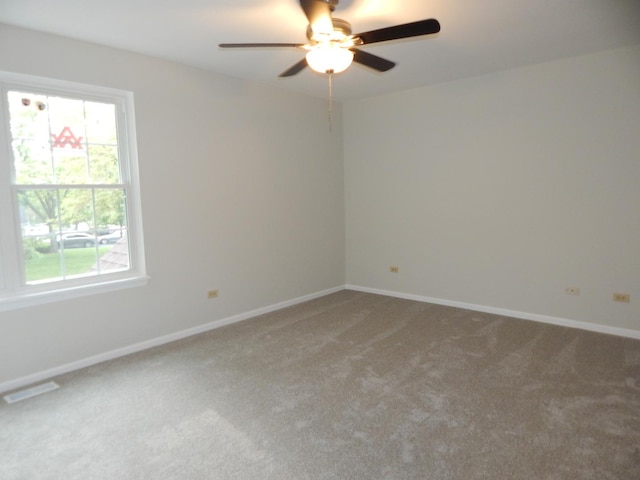 1 N Oltendorf Rd, Streamwood, IL 60107 - spare room with carpet flooring, healthy amount of natural light, a ceiling fan, and baseboards