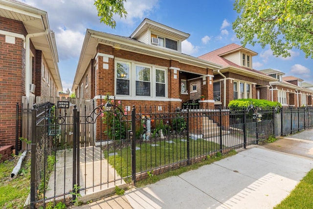 6142 S Richmond St, Chicago, IL 60629 - view of front facade with brick siding, a fenced front yard, and a gate