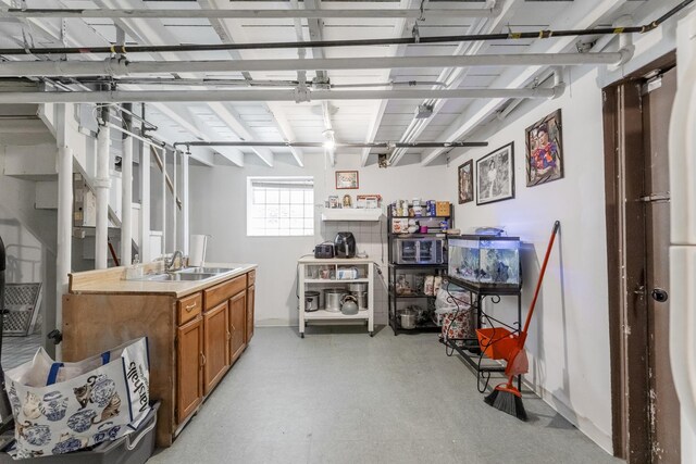 6142 S Richmond St, Chicago, IL 60629 - below grade area featuring a sink, baseboards, and a garage