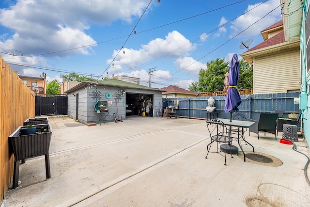 6142 S Richmond St, Chicago, IL 60629 - fenced backyard with a detached garage, outdoor dining space, a patio area, and an outdoor structure