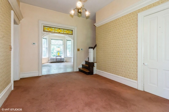 100 E Miller Ave, Hinckley, IL 60520 - entrance foyer with radiator, carpet, wallpapered walls, stairway, and arched walkways