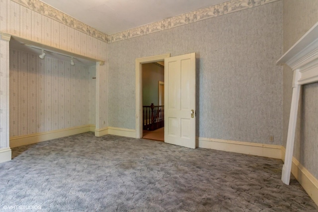 100 E Miller Ave, Hinckley, IL 60520 - carpeted spare room with wallpapered walls