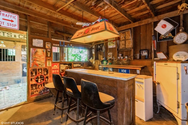 100 E Miller Ave, Hinckley, IL 60520 - bar area with concrete floors and wooden ceiling
