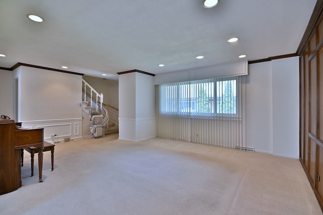 9044 N Clifton Ave, Niles, IL 60714 - unfurnished living room with crown molding, recessed lighting, carpet floors, stairs, and a decorative wall