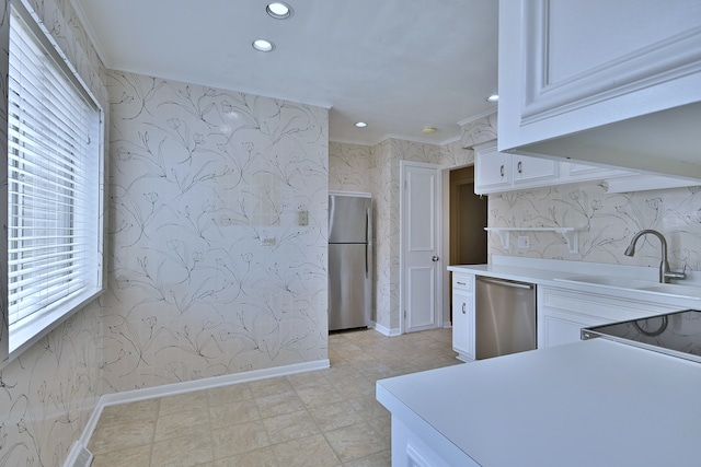 9044 N Clifton Ave, Niles, IL 60714 - kitchen featuring stainless steel appliances, crown molding, baseboards, light countertops, and a sink