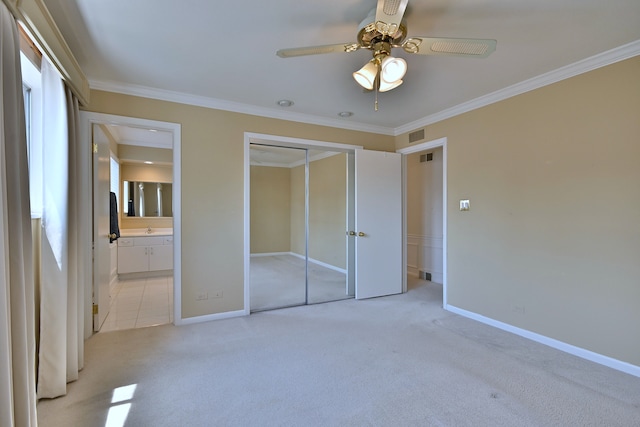 9044 N Clifton Ave, Niles, IL 60714 - unfurnished bedroom with light colored carpet, ornamental molding, baseboards, a closet, and ensuite bathroom