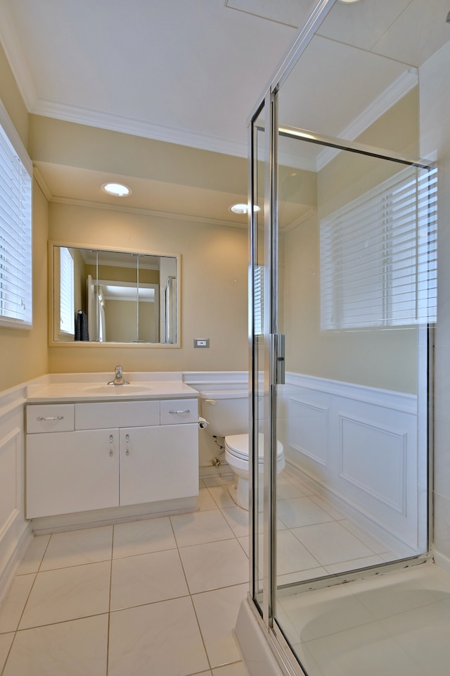 9044 N Clifton Ave, Niles, IL 60714 - full bath with crown molding, toilet, vanity, a shower stall, and wainscoting