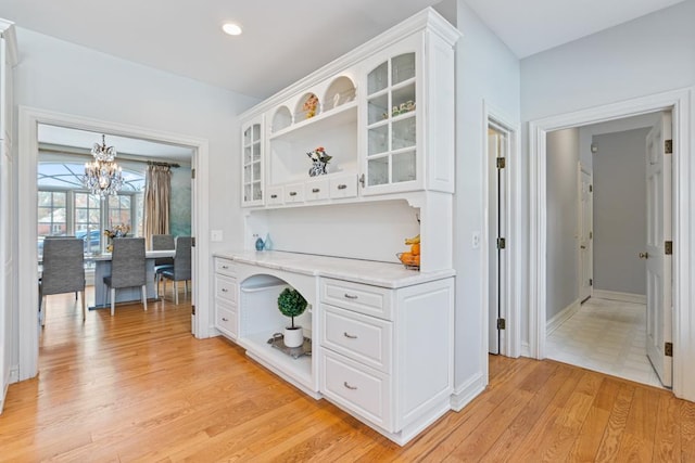 1455 Littlefield Ct, Lake Forest, IL 60045 - kitchen featuring open shelves, white cabinets, a chandelier, light wood-style floors, and recessed lighting