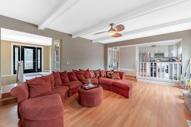 36W340 Huntley Rd, Dundee, IL 60118 - living room featuring light wood-style flooring, beamed ceiling, and a ceiling fan