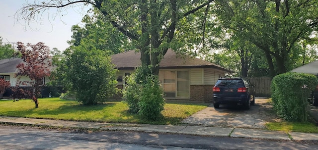 357 Niagara St, Park Forest, IL 60466 - view of property hidden behind natural elements featuring brick siding and driveway