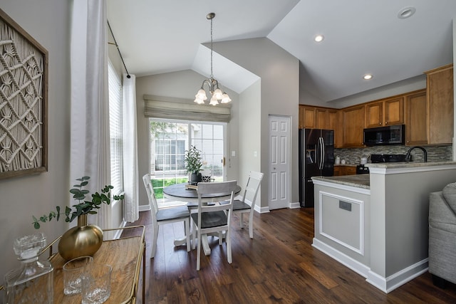 1850 Foxridge Ct, Aurora, IL 60502 - kitchen with black appliances, vaulted ceiling, brown cabinets, dark wood-style flooring, and backsplash