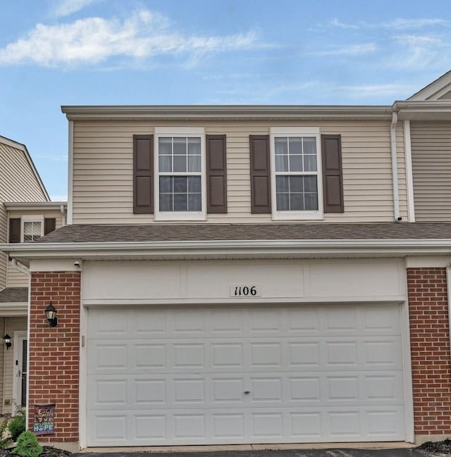1106 Heron Cir, Joliet, IL 60431 - traditional-style home with a garage and brick siding