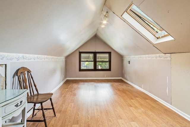 4427 N Kenneth Ave, Chicago, IL 60630 - bonus room with a skylight, light wood-style flooring, vaulted ceiling, and baseboards