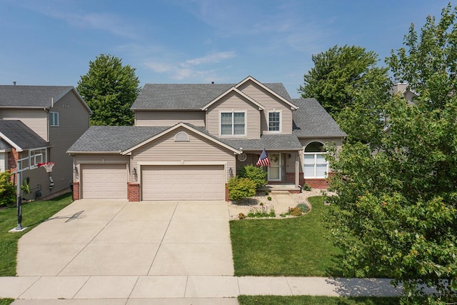 1207 Big Horn Way, Normal, IL 61761 - traditional-style home featuring brick siding, an attached garage, concrete driveway, and a front lawn