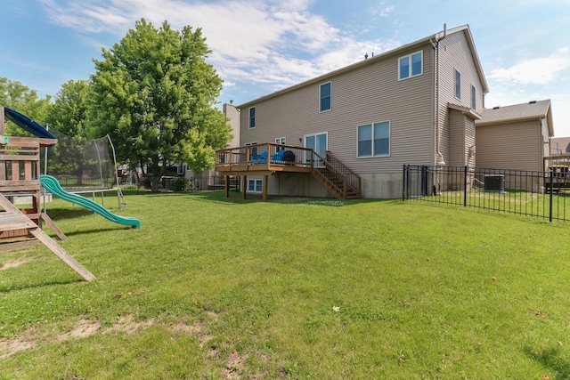 1207 Big Horn Way, Normal, IL 61761 - view of yard featuring stairway, a wooden deck, a trampoline, and a playground
