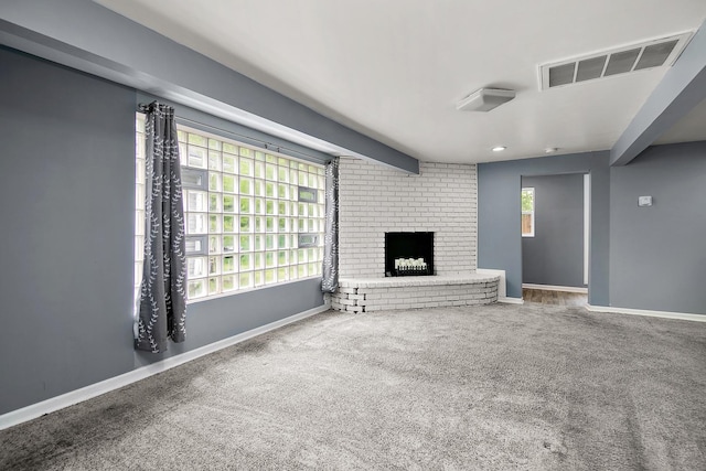 313 Dorsetshire Dr, Steger, IL 60475 - unfurnished living room featuring carpet flooring, a fireplace, and baseboards