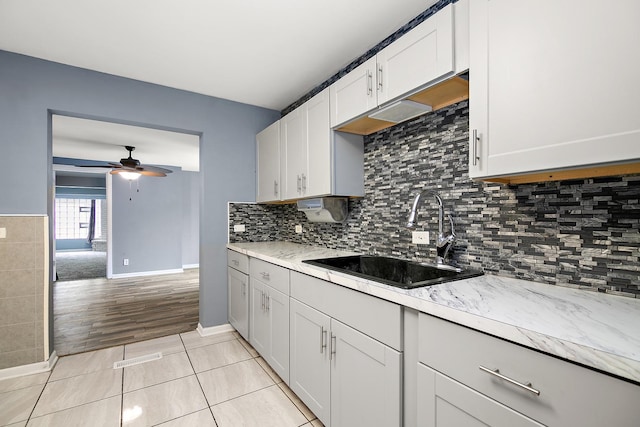 313 Dorsetshire Dr, Steger, IL 60475 - kitchen featuring a sink, ceiling fan, white cabinetry, baseboards, and light tile patterned floors