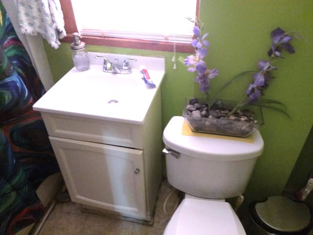 1415 N Maplewood Ave, Chicago, IL 60622 - half bathroom featuring vanity, toilet, and tile patterned floors