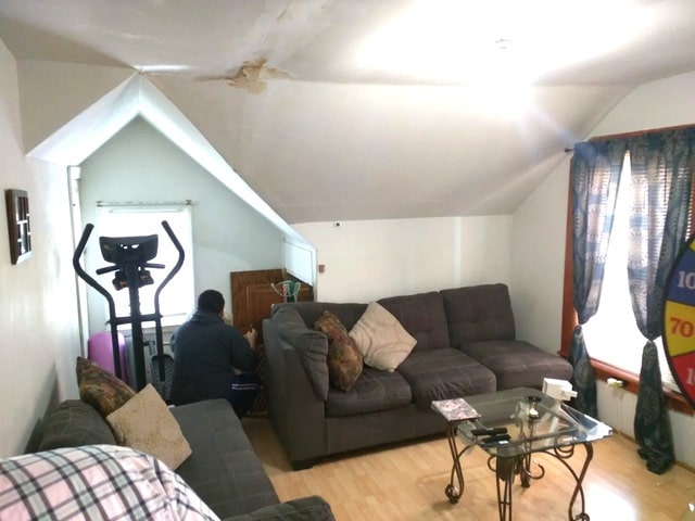 1415 N Maplewood Ave, Chicago, IL 60622 - living area with wood finished floors and lofted ceiling