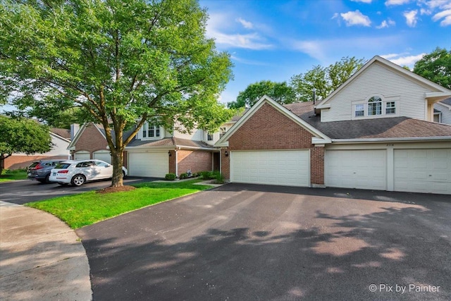 2116 Glasgow Ct, Hanover Park, IL 60133 - view of front facade featuring brick siding, driveway, and roof with shingles