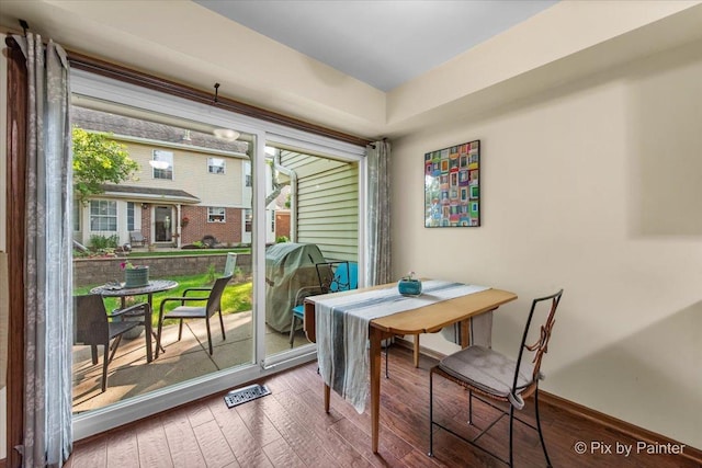 2116 Glasgow Ct, Hanover Park, IL 60133 - dining area featuring wood-type flooring and baseboards