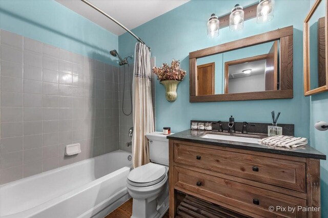 2116 Glasgow Ct, Hanover Park, IL 60133 - bathroom featuring vanity, shower / bathtub combination with curtain, and wood finished floors