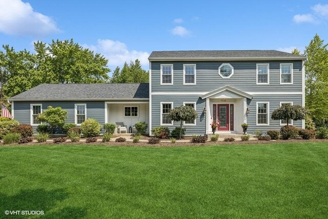 7536 Inverway Dr, Lakewood, IL 60014 - colonial-style house featuring a front yard