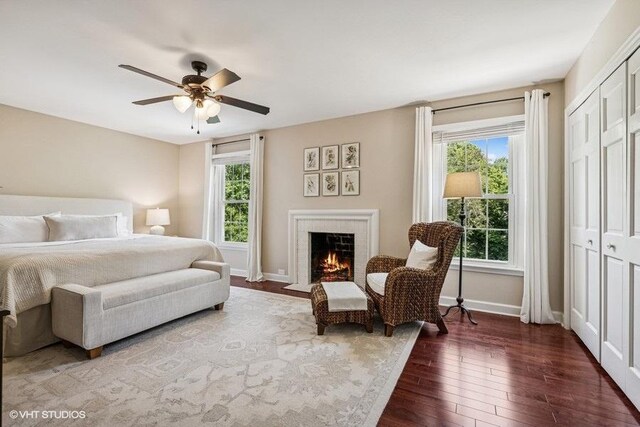 7536 Inverway Dr, Lakewood, IL 60014 - bedroom featuring wood-type flooring, a fireplace, and ceiling fan