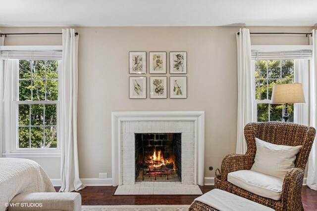 7536 Inverway Dr, Lakewood, IL 60014 - living area featuring a brick fireplace and wood finished floors