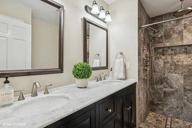 7536 Inverway Dr, Lakewood, IL 60014 - bathroom featuring double vanity and a tile shower