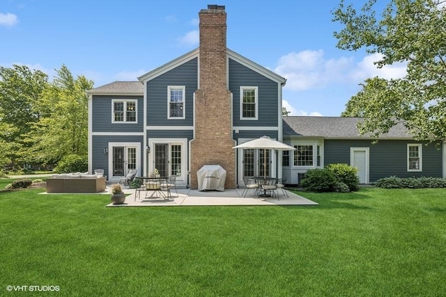 7536 Inverway Dr, Lakewood, IL 60014 - back of property featuring a lawn, a patio, a chimney, french doors, and an outdoor living space