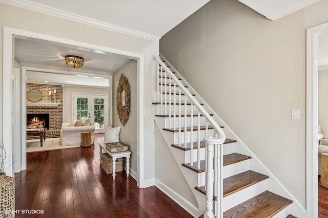 7536 Inverway Dr, Lakewood, IL 60014 - stairs with hardwood / wood-style floors, a brick fireplace, and ornamental molding